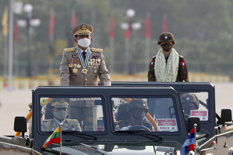 Myanmar military Commander-in-Chief Senior General Min Aung Hlaing (L) participates in a parade during the 77th Armed Forces Day in Naypyidaw, Myanmar, March 27, 2022. Nyein Chan Naing, EPA-EFE/File.