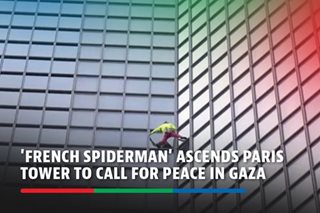 'French Spiderman' ascends Paris tower to call for peace in Gaza