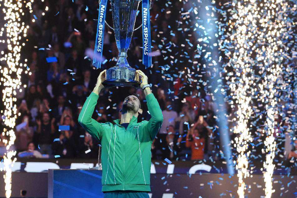 Novak Djokovic of Serbia poses with the trophy after winning his singles finals match against Jannik Sinner of Italy at the Nitto ATP Finals tennis tournament in Turin, Italy, November 19, 2023. Alessandro di Marco, EPA-EFE