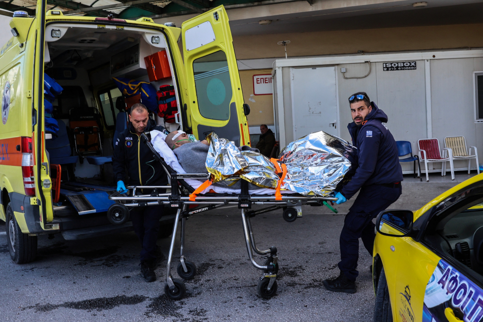 Medical staff carry on a stretcher a survivor from the Comoros-flagged cargo ship that has sunk off the island of Lesbos, at a hospital on Lesbos Island on November 26, 2023. Manolis Lagoutaris, AFP.
