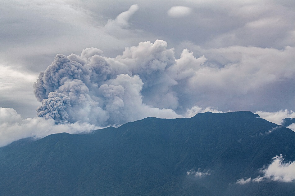 Volcanic ash spews from Mount Marapi during an eruption as seen from Tanah Datar in West Sumatra on December 3, 2023. A volcano in western Indonesia erupted on December 3, belching a column of ash around three kilometers into the sky and forcing the evacuation of dozens of hikers, officials said. Adi Prima, AFP.