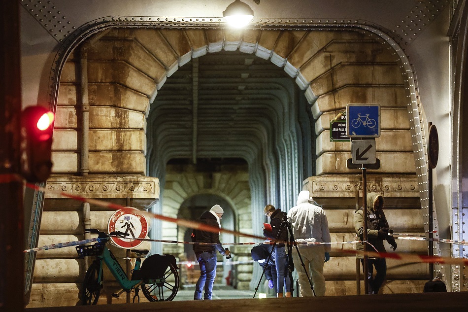 French forensic policemen investigate the scene following a knife attack in Paris Paris, France, December 3, 2023. French Interior Minister Minister Gerald Darmanin announced one person died and two others were injured after a stabbing attack near the Eiffel Tower on the night of December 2. Yoan Valat, EPA-EFE.