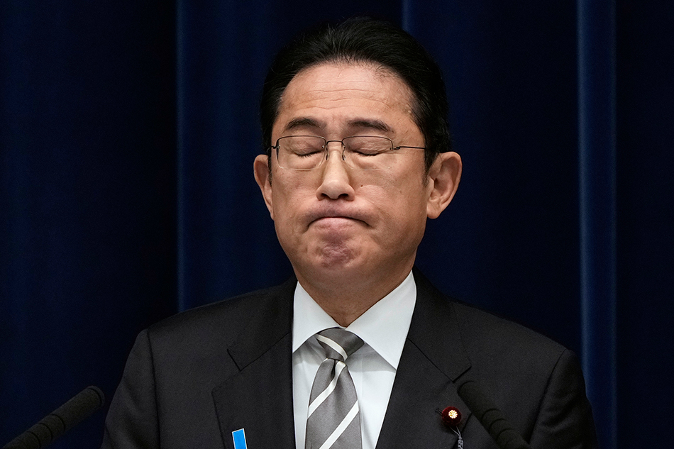 Japanese Prime Minister Fumio Kishida reacts during a news conference at the Prime Minister