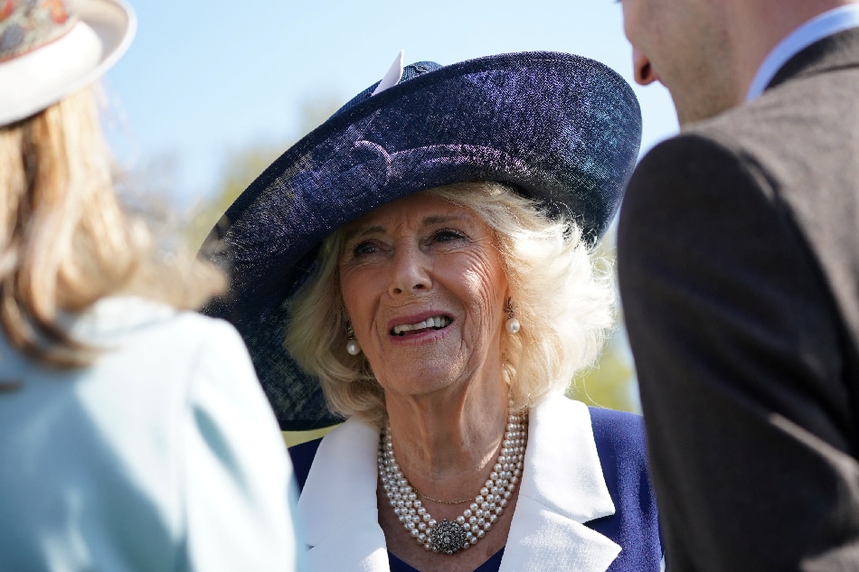 Britain's Camilla, Queen Consort meets guests during the Garden Party at Buckingham Palace, in London, on May 3, 2023 to celebrate her and her husband Britain's King Charles III coronation ceremony as King and Queen of the United Kingdom and Commonwealth Realm nations, on May 6, 2023. (Photo by Yui Mok / POOL / AFP)