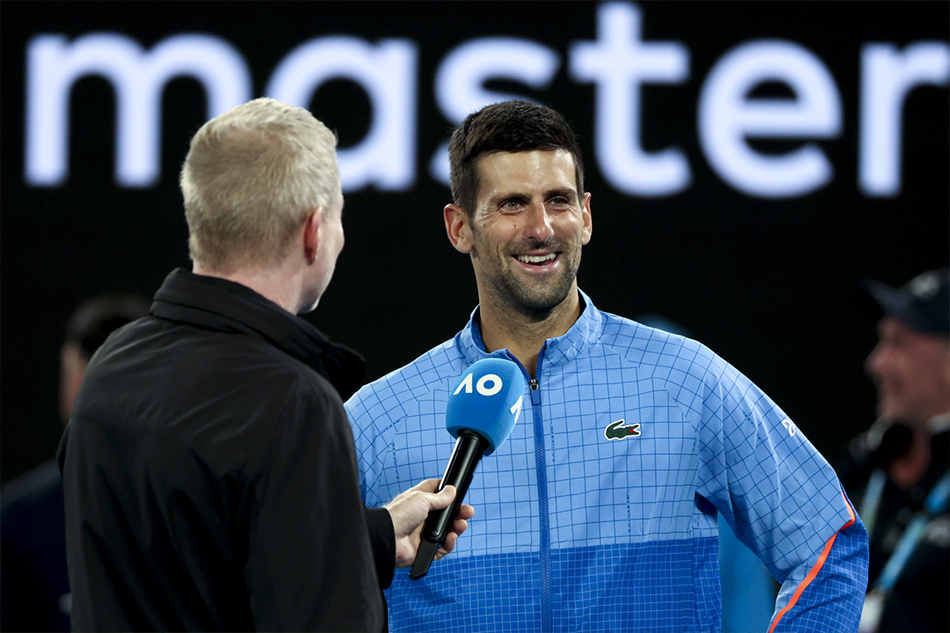 Novak Djokovic (R) of Serbia is interviewed on court by Jim Courier after defeating Andrey Rublev of Russia in their quarter final match at the Australian Open tennis tournament in Melbourne, Australia, 25 January 2023. EPA-EFE/Fazry Ismail 