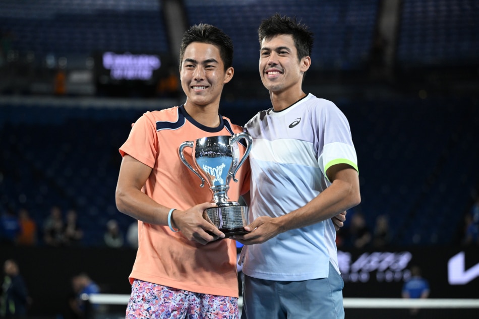 Australia’s Rinky Hijikata (left) and Jason Kubler celebrate with their trophy after winning the men’s doubles final against Hugo Nys of Monaco and Jan Zielinski of Poland at the 2023 Australian Open tennis tournament in Melbourne, Australia, 28 January 2023. James Ross, EPA-EFE.