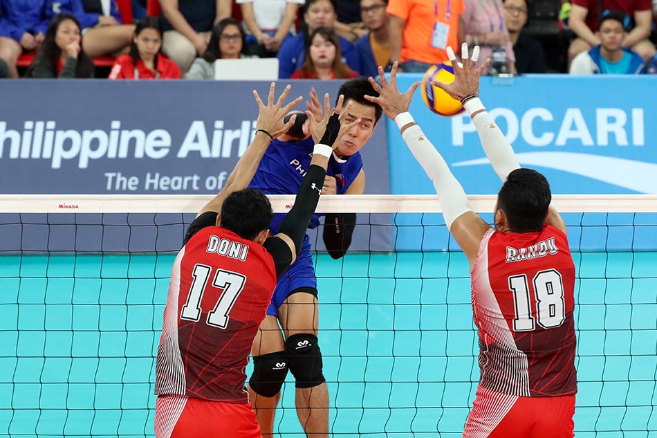 Bryan Bagunas of the Philippines spikes the ball during their gold medal match against Indonesia in SEA Games men’s indoor volleyball held at the PhilSports Arena in Pasig on December 10, 2019. George Calvelo, ABS-CBN News