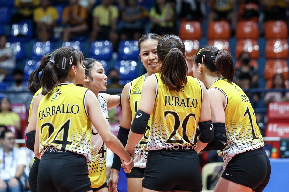 The UST Golden Tigresses celebrate a point against the UE Lady Warriors in their UAAP Season 85 women's volleyball match. UAAP Media.