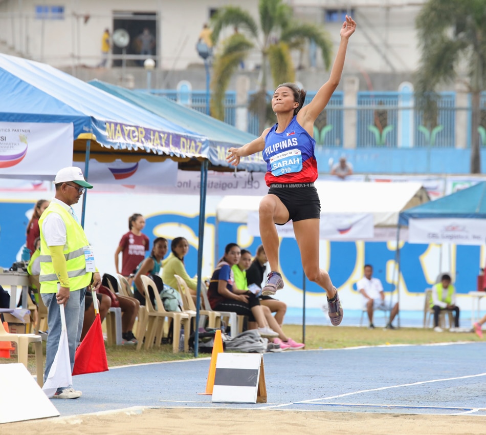 Sarah Dequinan leaps to victory in the women's long jump. PATAFA