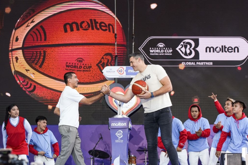 FIBA ambassadors LA Tenorio (L) and Luis Scola during the unveiling of the official game ball for the FIBA Basketball World Cup 2023 at the Bonifacio Global City on April 29, 2023. FIBA photo.