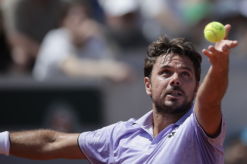 Stan Wawrinka of Switzerland serves to Albert Ramos-Vinolas of Spain in their Men's Singles first round match during the French Open Grand Slam tennis tournament at Roland Garros in Paris, France, on May 29, 2023. Christophe Petit-Tesson, EPA-EFE.