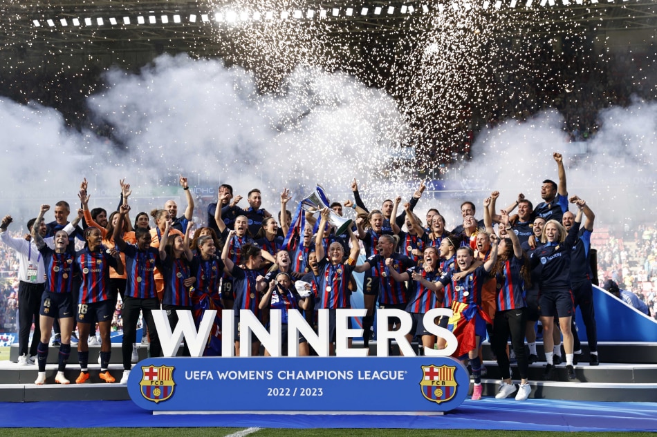 FC Barcelona players celebrate with the trophy after winning the UEFA Women's Champions League Final between FC Barcelona and VfL Wolfsburg in Eindhoven, Netherlands, June 3, 2023. Maurice Van Steen, EPA-EFE.