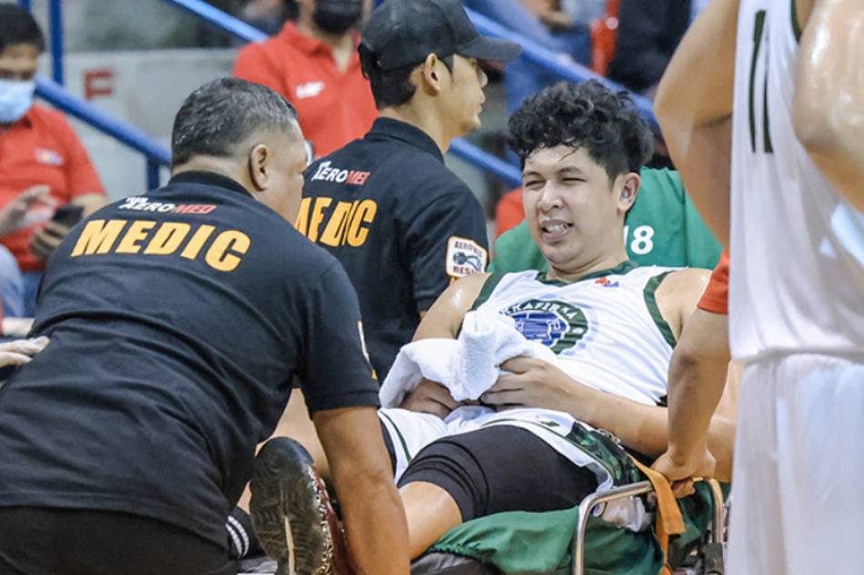 Kevin Ferrer grimaces in pain after he accidentally tore his Achilles tendon. PBA Images/file