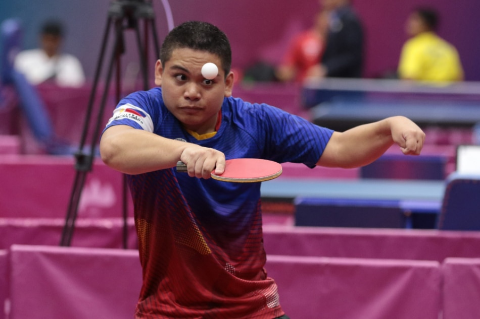 Angelo Haganas competes against Ekkarin of Thailand in the individual single class 4 of table tennis at Tennis hall in Morodok Techo National Stadium at the 12th ASEAN Para Games Phnom Penh Cambodia. Handout photo