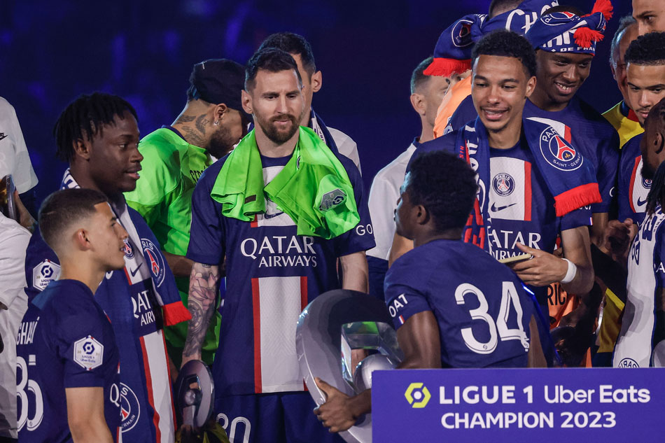 Paris Saint Germain's Lionel Messi (C) interacts with teammates next to French Ligue 1 trophy during a ceremony following the French Ligue 1 soccer match between Paris Saint Germain and Clermont Foot 63 in Paris, France, June 3, 2023. Christophe Petit Tesson, EPA-EFE.