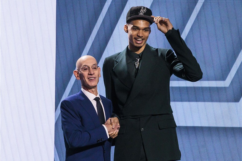 French basketball player Victor Wembanyama (R) with NBA Commissioner Adam Silver (L) after being selected as the first overall draft pick by the San Antonio Spurs in 2023 NBA Draft, in Brooklyn, New York. Justin Lane, EPA-EFE