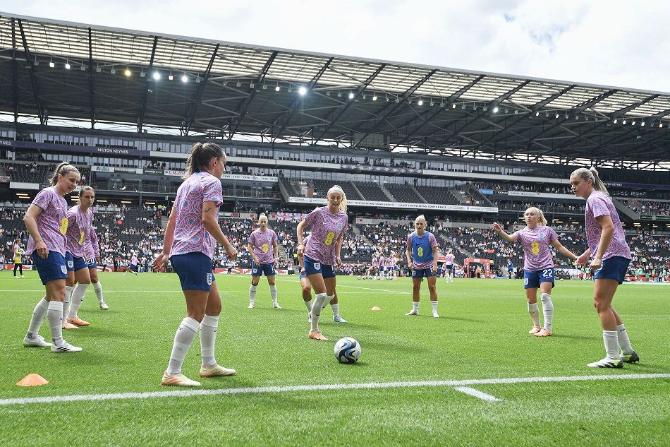 The England team warm up ahead of the international friendly between England and Portugal in Milton Keynes, Britain, July 1, 2023. Vince Mignott, EPA-EFE/File.