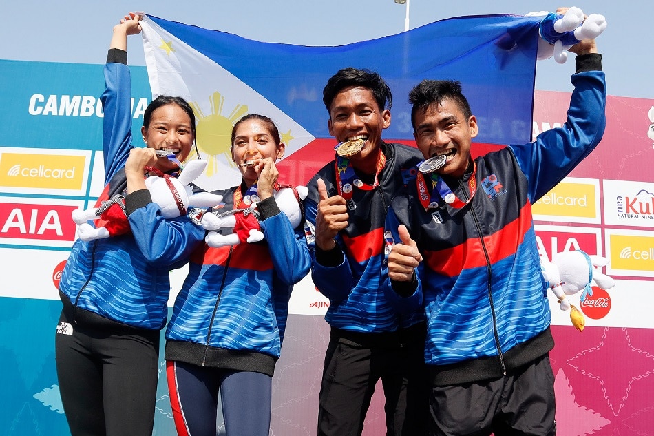 Philippine obstacle racers (from left) Kaizen Dela Cerna (Silver), Precious Cabuya(Gold), Mark Julius Rodelas(Gold) and Kevin Jeffrey Pascua(Silver) pose for photos after winning the Men and Women Individual Obstacle Race at the 32nd Southeast Asia Games in Phnom Penh, Cambodia on May 6, 2023. POC/PSC Media/ handout