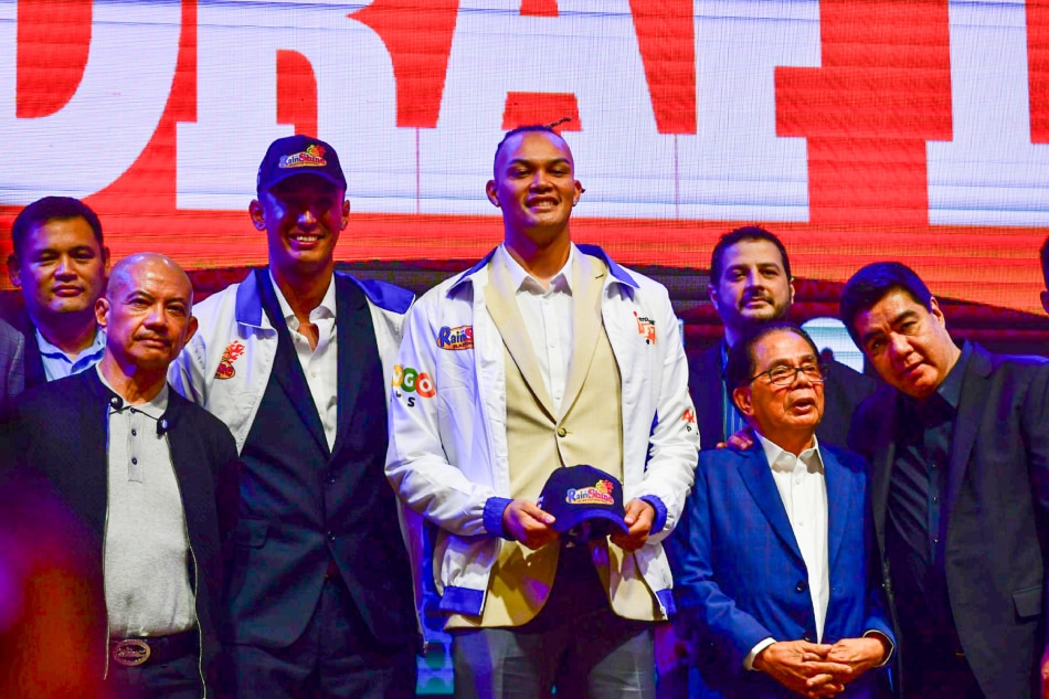 Luis Villegas and Keith Datu pose with Rain or Shine officials during the 2023 PBA Draft in Taguig City on September 17, 2023. Mark Demayo, ABS-CBN News