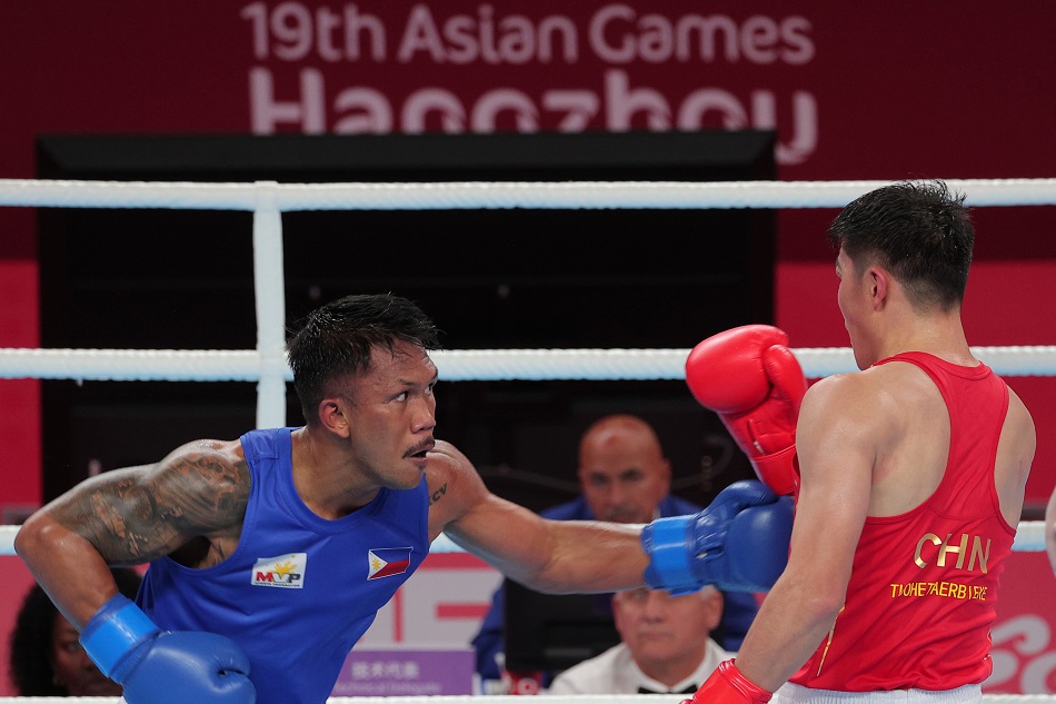 Eumir Marcial of the Philippines takes on  Tuohetaerbieke Tanglatihan of China in their gold medal match of the men