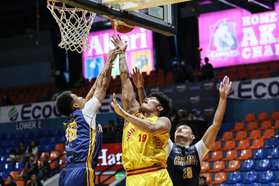 Basketball action between JRU and San Sebastian. From the NCAA