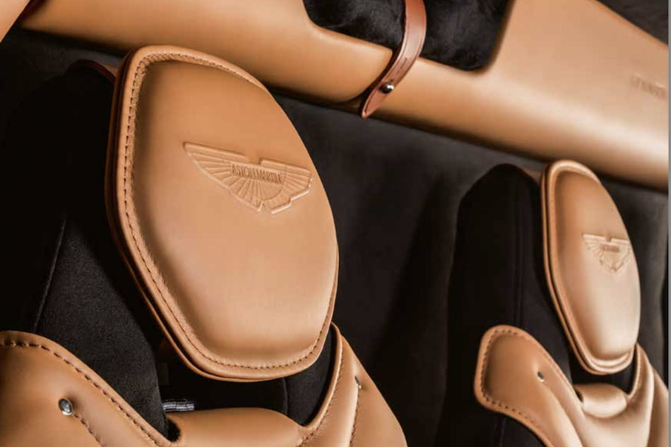 The luxuriously upholstered seats bear the stamp of Aston Martin. 