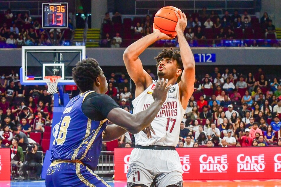 UP’s Francis Lopez attempts a jumper against the NU Bulldogs. Mark Demayo, ABS-CBN News. 