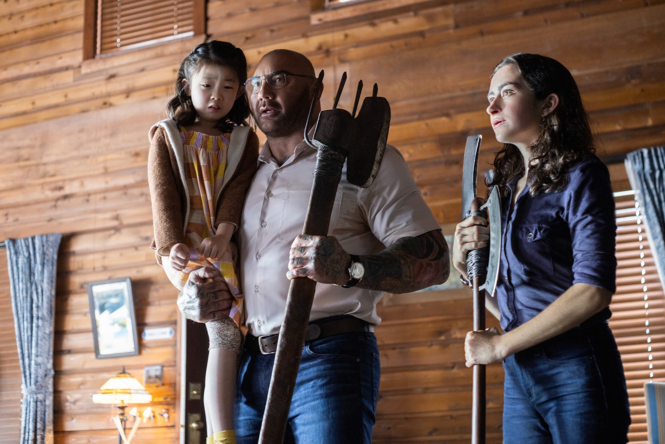 Dave Batista with Kristen Cui and Abby Quinn. Photo credit: Universal 'Knock At The Cabin'