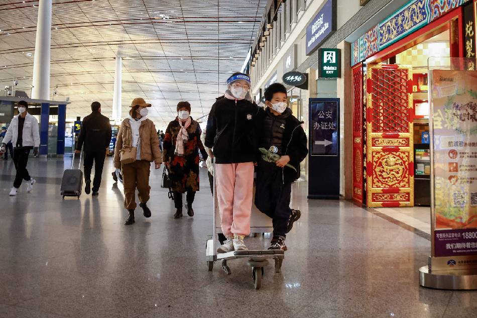 Passengers walk inside the Beijing Capital International Airport in Beijing, China, Jan. 1, 2023. Mark R. Cristino, EPA-EFE 