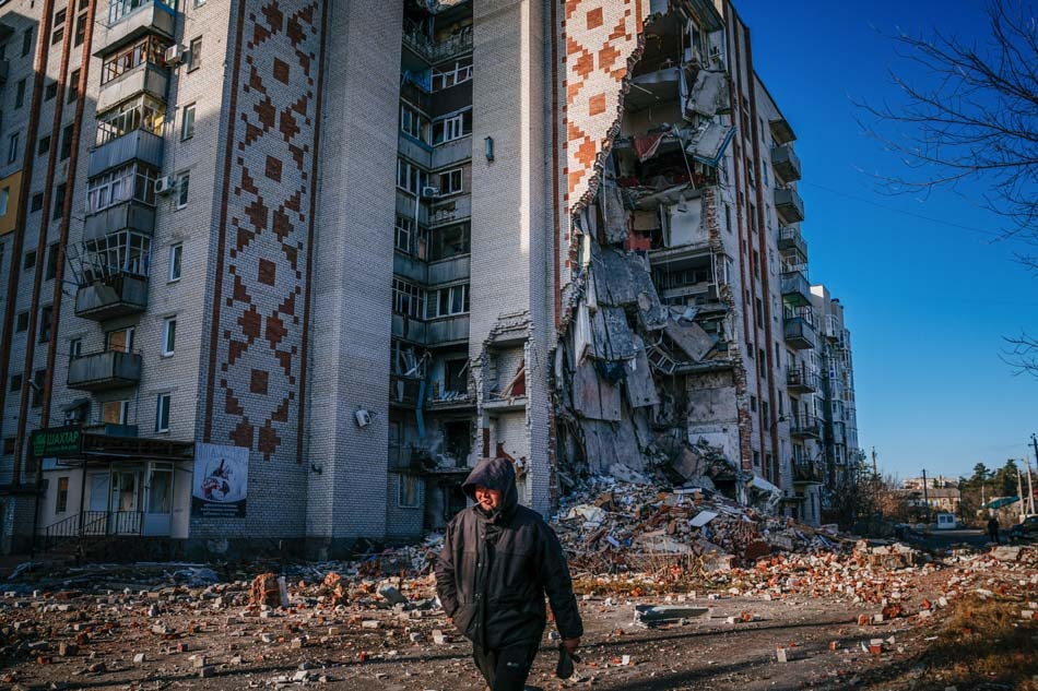 A man walks by a destroyed residential building in the city of Lyman, Donetsk region on Wednesday amid the Russian invasion of Ukraine. Russia’s defense ministry reported that 89 Russian soldiers were killed during a strike in Makiivka on December 31 carried out by Ukranian forces in response to a wave of Russian strikes on Ukrainian targets. Dimitar Dilkoff, AFP