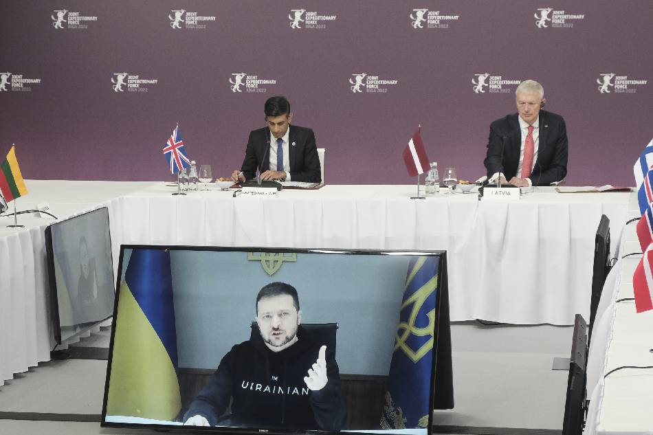 Ukraine's President Volodymyr Zelensky (on screen) addresses participiants to the Summit of the Joint Expeditionary Force (JEF), as Britain's Prime Minister Rishi Sunak (L) and Latvia's Prime Minister Krisjanis Karins look on, in Riga, Latvia, 19 December 2022. The JEF heads of state, government and ministers met in Riga to discuss Russia's invasion of Ukraine and consequent changes in the security climate in the North Atlantic, Baltic Sea and the High North regions, and on measures to improve regional security. The JEF is a coalition of nations (Denmark, Estonia, Finland, Iceland, Latvia, Lithuania, Netherlands, Norway, Sweden and the United Kingdom). EPA-EFE/VALDA KALNINA