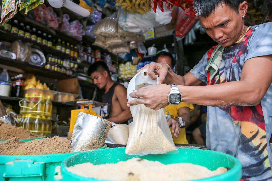 Vendors sell sugar by the kilo at the Bagong Silang public market in North Caloocan on Aug. 11, 2022. Jonathan Cellona, ABS-CBN News/File