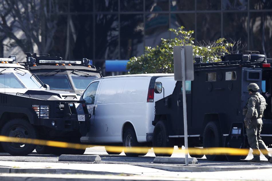 A white van which police reported was connected with a mass shooting at a dance studio in Monterey Park, California, sits trapped between two heavily armored police vehicles in Torrance, California, USA, 22 January 2023. The shooting killed ten and wounded ten more during a Lunar New Year celebration according to the Los Angeles County Sheriff's Department. EPA-EFE/CAROLINE BREHMAN