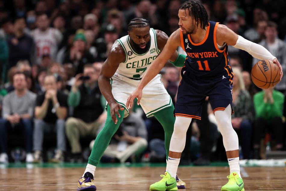 Jaylen Brown (7) of the Boston Celtics defends Jalen Brunson (11) of the New York Knicks at TD Garden in Boston, Massachusetts. Maddie Meyer, Getty Images/AFP