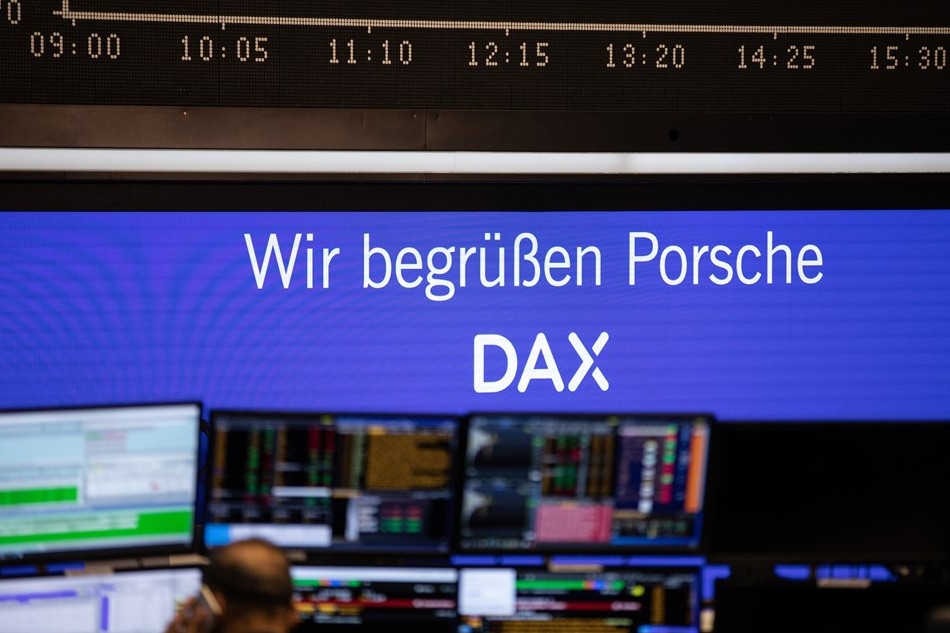 A view of a display reading in German ‘We welcome Porsche in DAX’, at the Frankfurt Stock Exchange in Frankfurt am Main, Germany, 19 December 2022. EPA-EFE/ANDRE PAIN