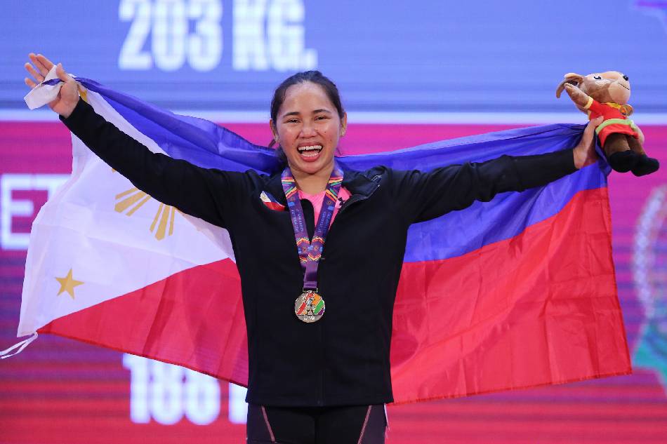 Hidilyn Diaz of Philippines celebrates after winning gold in the 55kg women's weightlifting competition during the 31st Southeast Asian Games (SEA Games 31) in Hanoi, Vietnam, 20 May 2022. File photo. Luong Thai Linh, EPA-EFE.