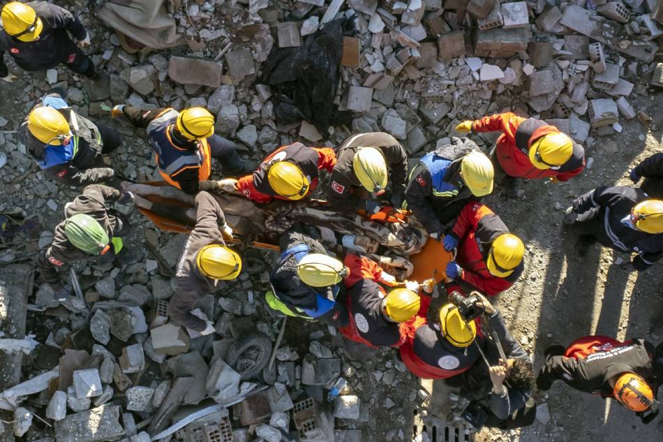 A photo taken with a drone shows rescuers carry a survivor, who was rescued from a collapsed building after 60 hours after an earthquake in Hatay, Turkey, 08 February 2023. More than 11,000 people have died and thousands more are injured after two major earthquakes struck southern Turkey and northern Syria on 06 February. Authorities fear the death toll will keep climbing as rescuers look for survivors across the region. EPA-EFE/ERDEM SAHIN