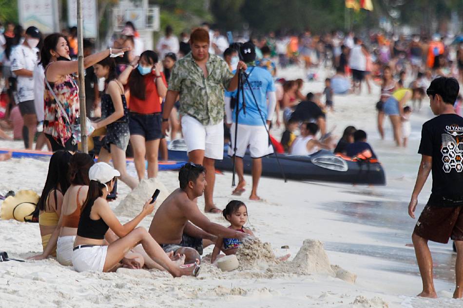Boracy tourist jpeg attached) Tourists enjoy the beach in Boracay’s Station 2 on February 12, 2022. Boracay remains among the top destination for domestic travel according to Klook. ABS-CBN News/File