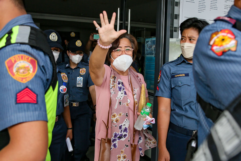 Senator Leila De Lima is escorted by members of the Philippine National Police (PNP) after her drug case hearing at the Muntinlupa Regional Trial court branch 204 in Muntinlupa City on April 17, 2023. Jonathan Cellona, ABS-CBN News