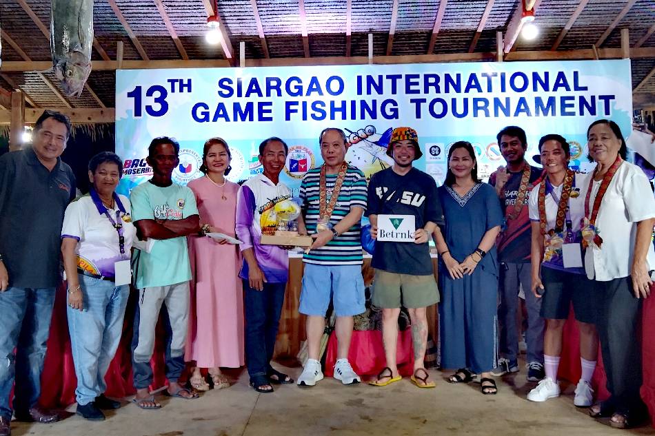 Top winner Santiago Gonzales (fifth from left) at the awarding ceremonies. Handout