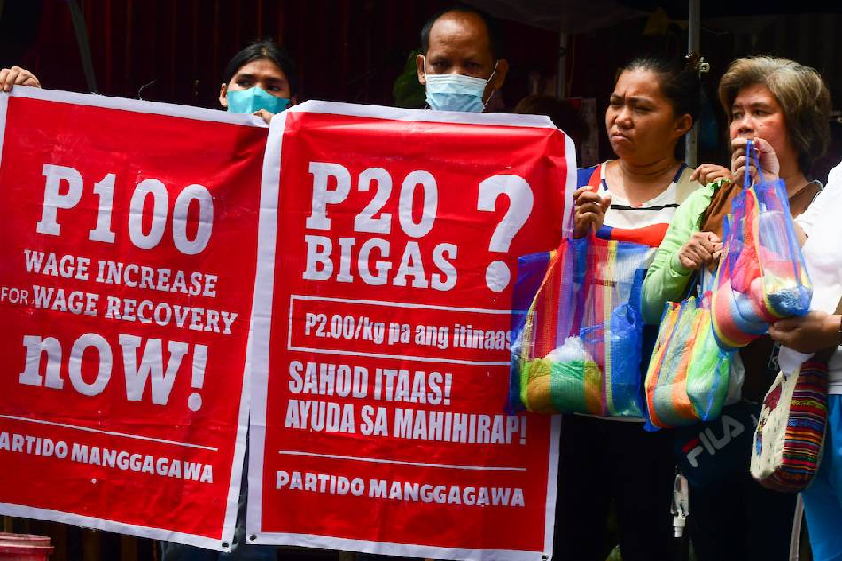Women, carrying limited budgets ranging from 100 to 150 Php, purchase goods for their family's meal for the day in a market in Manila on April 27, 2023. Mark Demayo, ABS-CBN News