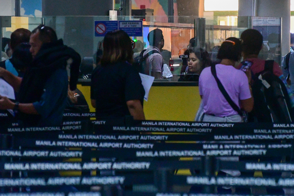 Departing passengers queue before the immigration counters at the Ninoy Aquino International Airport Terminal 3 in Pasay City on July 4, 2023. Mark Demayo, ABS-CBN News