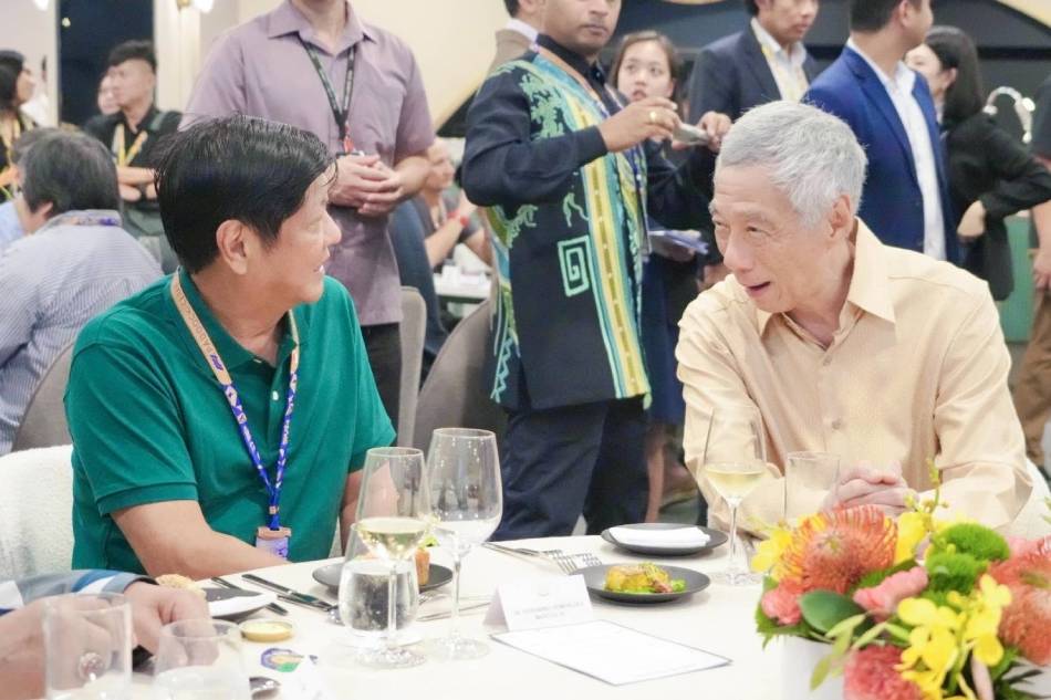 President Bongbong Marcos Jr. chats with Singapore's prime minister Lee Hsien Loong during the F1 race in Singapore. Marcos/Facebook 