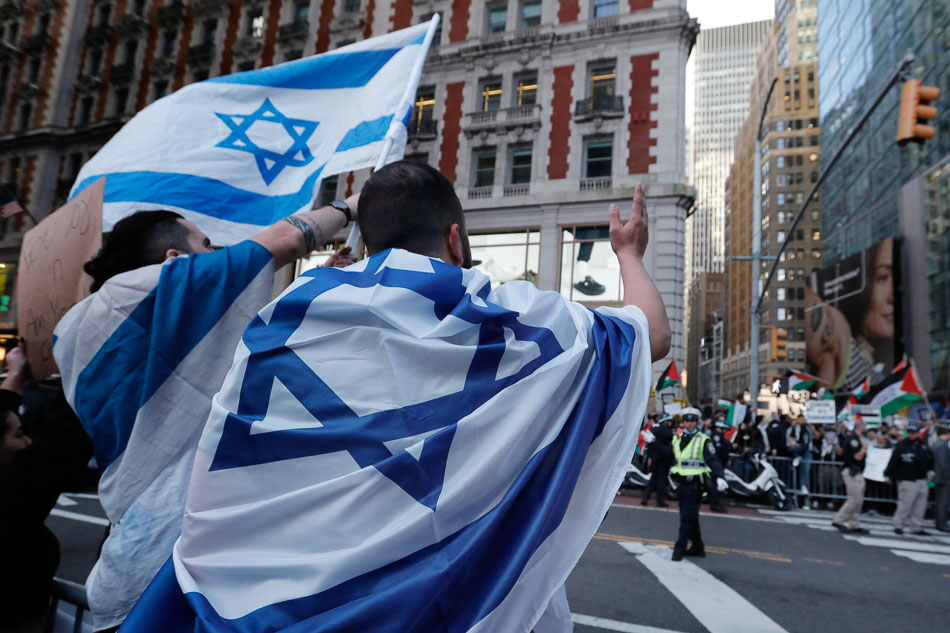 Supporters of Israel wave flags across the street from a Pro-Palestine rally, near Times Square in New York, New York on October 14, 2023. Thousands of Israelis and Palestinians have died since the militant group Hamas launched an unprecedented attack on Israel from the Gaza Strip on October 7, 2023, leading to Israeli retaliation strikes on the Palestinian enclave. Peter Foley, EPA-EFE