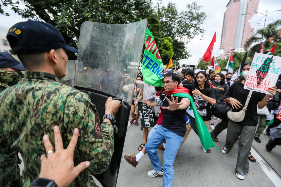 Anti-riot police clash with Pro-Palestine protesters near the US Embassy in Manila on November 14, 2023 during a protest denouncing the ongoing Israeli airstrikes in Gaza. The group or protesters condemned the role of the US government in the ongoing attacks in Gaza and raised concern about the new round of US military exercises in the Philippines. ABS-CBN News/Jonathan Cellona