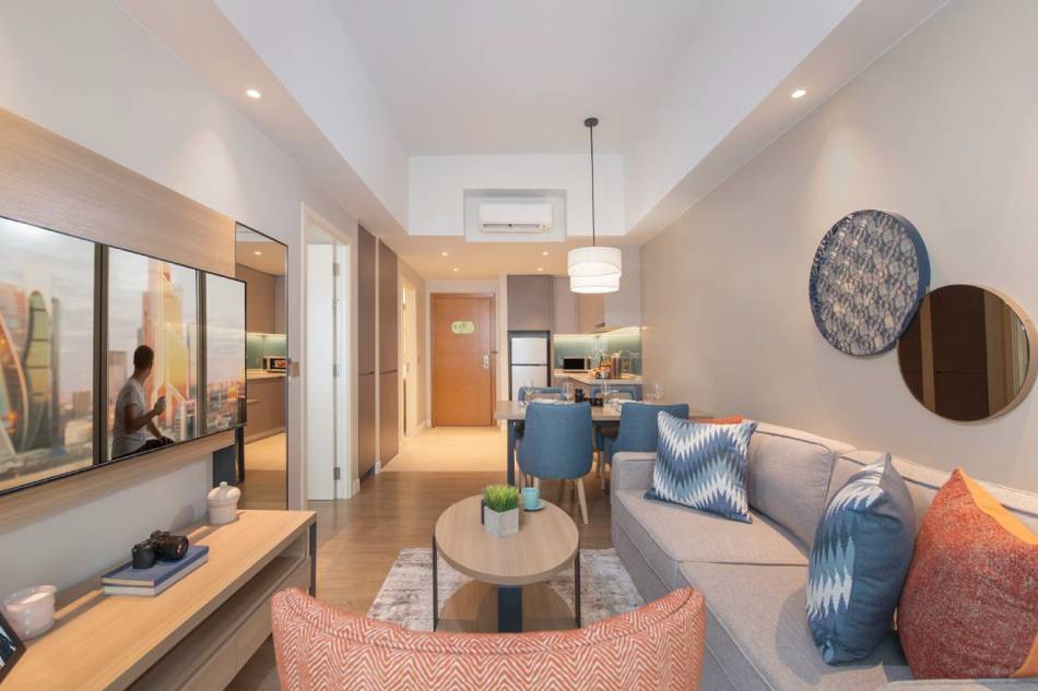 Each room is fitted with modern amenities like a kitchenette with a full-sized refrigerator, designed to facilitate daily living and ensure a comfortable and enjoyable stay. Photo source: Citadines