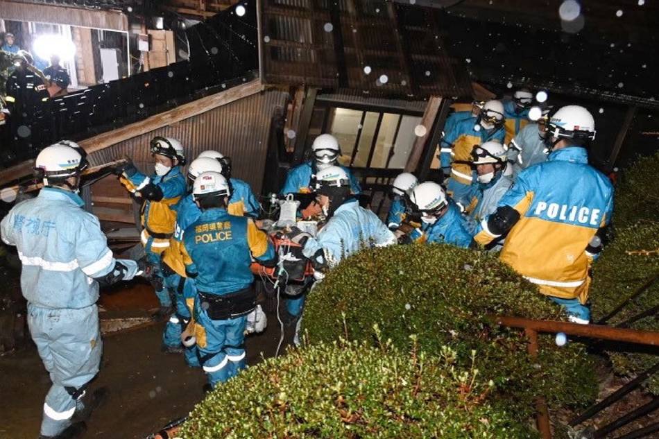This handout picture provided by Metropolitan Police Department via Jiji Press shows police officers rescuing a woman in her 90s at a collapsed house five days after a powerful earthquake hit the region in Suzu, Ishikawa Prefecture, Japan, late 06 January 2024 (issued 07 January 2024). EPA-EFE/Metropolitan Police Department/handout