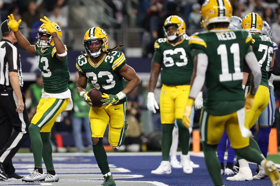 Green Bay Packers running back Aaron Jones (33) reacts after scoring a touchdown against the Dallas Cowboys during the first quarter for the 2024 NFC wild card game at the AT&T Stadium in Arlington, Texas on Jan 14, 2024. Kevin Jairaj, USA TODAY Sports/Reuters