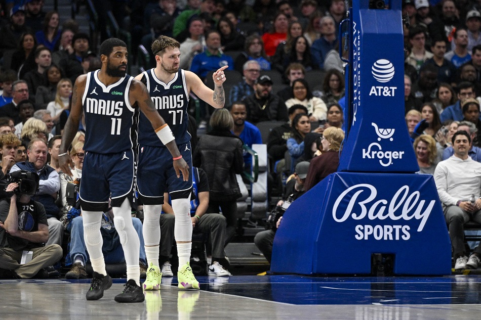 Dallas Mavericks guard Kyrie Irving (11) and guard Luka Doncic (77) face the Portland Trail Blazers attack during the second half at the American Airlines Center on January 3, 2024. Jerome Miron, USA TODAY Sports/Reuters.