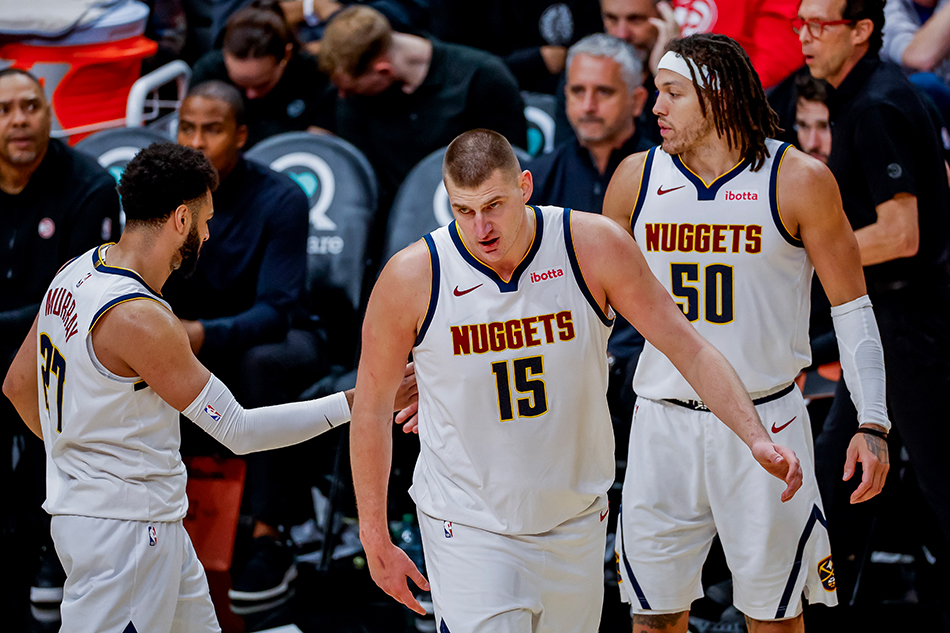Denver Nuggets center Nikola Jokic (C) of Serbia reacts with Nuggets guard Jamal Murray (L) of Canada and forward Aaron Gordon (R) during the second half of the NBA basketball game between the Denver Nuggets and the Atlanta Hawks at State Farm Arena in Atlanta, Georgia, USA, December 11, 2023. Erik S. Lesser, EPA-EFE/File.